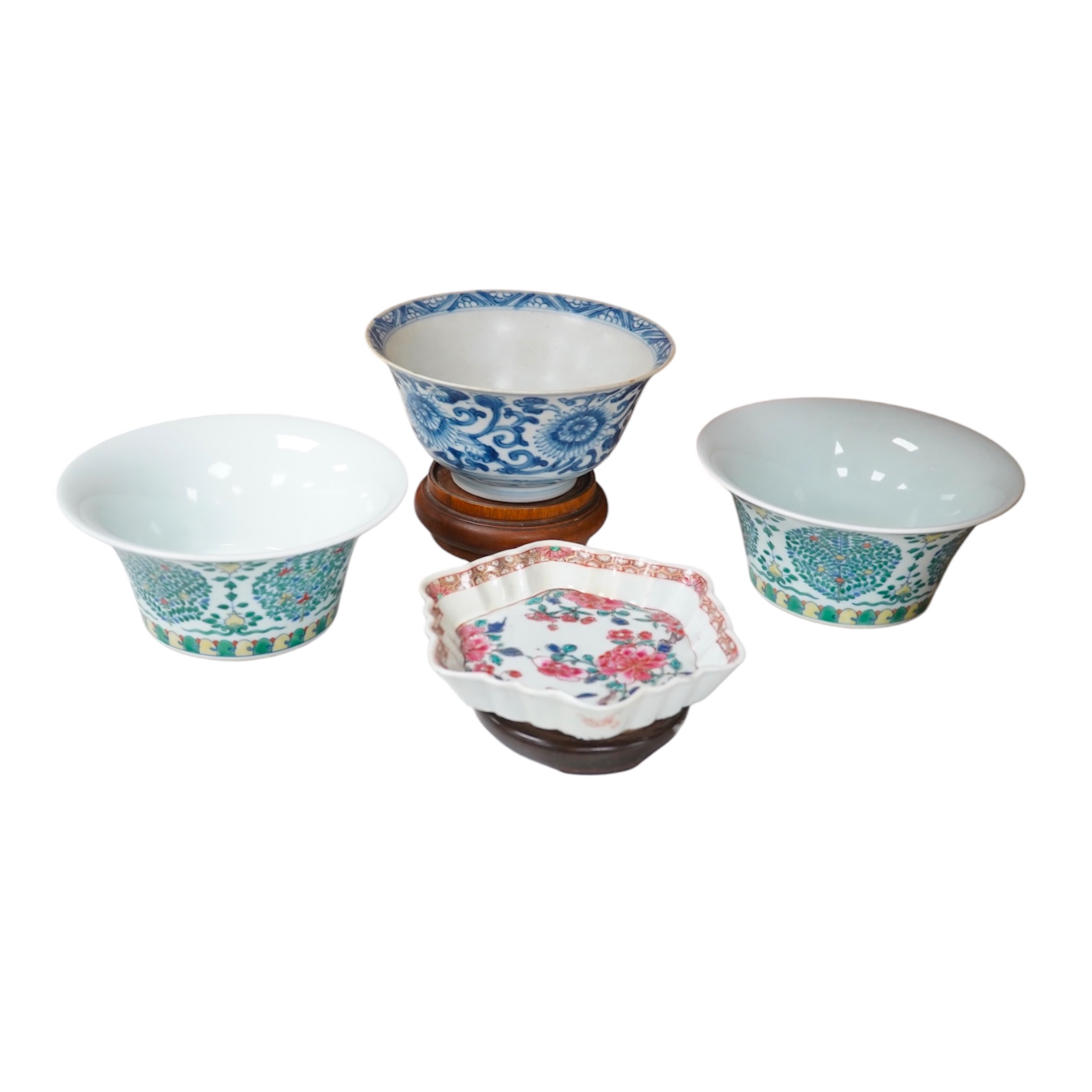 A Chinese blue and white bowl, Kangxi, 15cm. diam., a famille rose teapot stand, Yongzheng, and two doucai bowls. Condition - varies